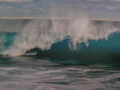 Surfing the ocean waves on the North Shore of Oahu, Hawaii