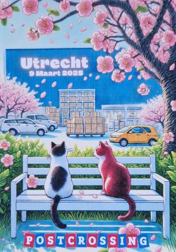 Cherry blossoms and a couple of cats sitting on a bench