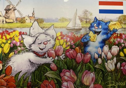 Vintage Dutch postcard with a cat and tulips in Holland
