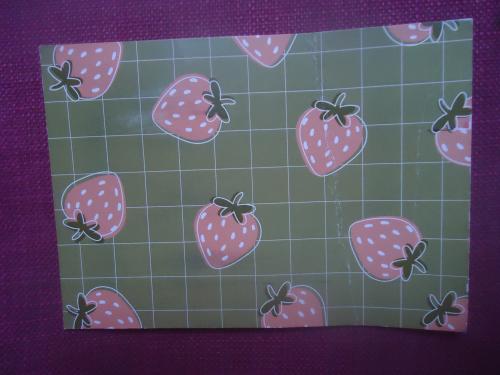 Strawberries on the background of a blue plaid fabric.