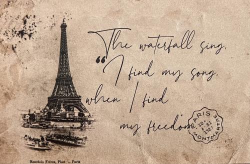 The Eiffel Tower on an old postcard from Paris.