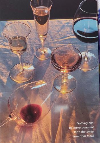 Glasses of red and white wine on a table in a restaurant