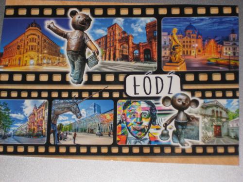 Vintage film strip with a picture of the old town in the background