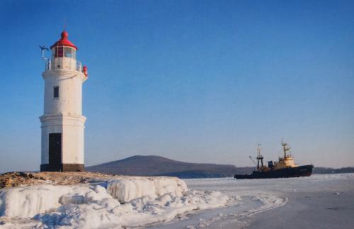 Lighthouse on the ice in winter. Lake Baikal.
