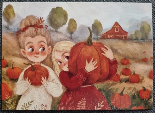 Vintage postcard with two children playing with pumpkins in the field