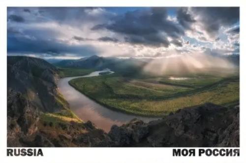 Mountain landscape with river and clouds in the sky. Panorama.