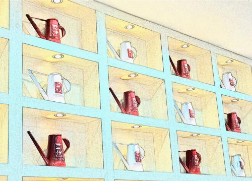 Coffee shop window with a row of coffee cups on it