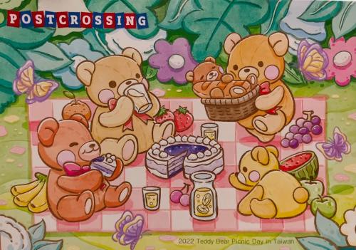 Teddy bear with a basket of fruit on a checkered tablecloth