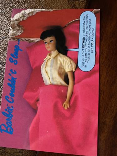 Doll in a red dress and with the inscription on the door