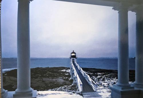 Lighthouse on the rock in the foggy morning. Winter view
