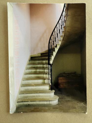 Staircase in a building with a metal handrails.