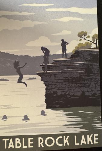 A vertical shot of a silhouette of a man jumping from a cliff into a lake