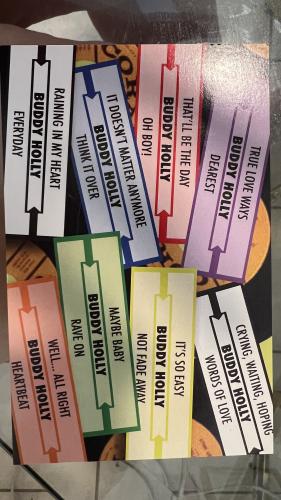Close-up of business cards in a shop window.