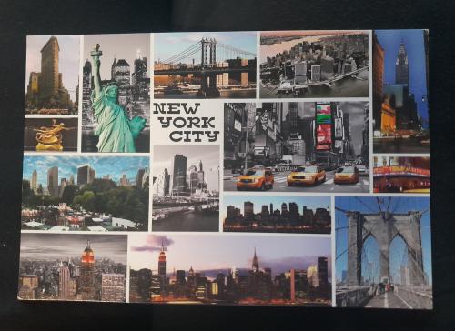A postcard printed in New York shows the Manhattan skyline.
