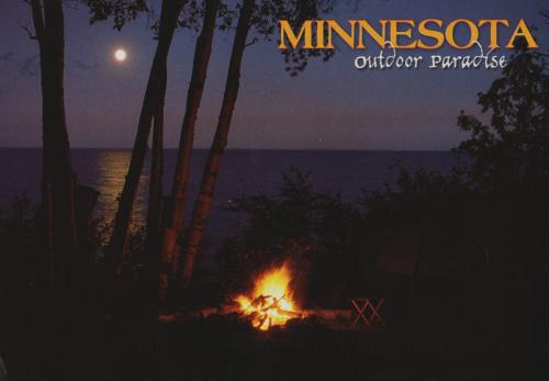 Camping on the shore of the lake at night and a bonfire