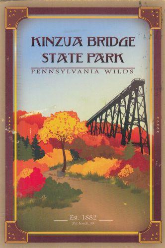 Vintage travel postcard with railroad bridge over river in autumn.