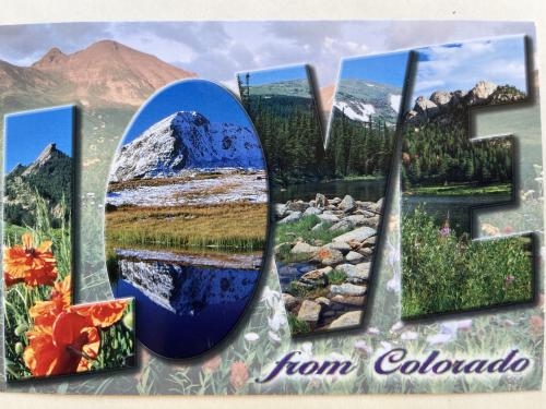A stamp printed by Canada shows image of a lake and mountains in the background.