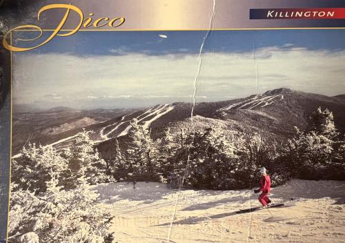 Vintage photo of a skier on the piste in the mountains