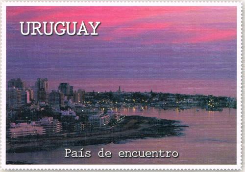 A stamp printed in the United States of America shows the Seattle skyline.
